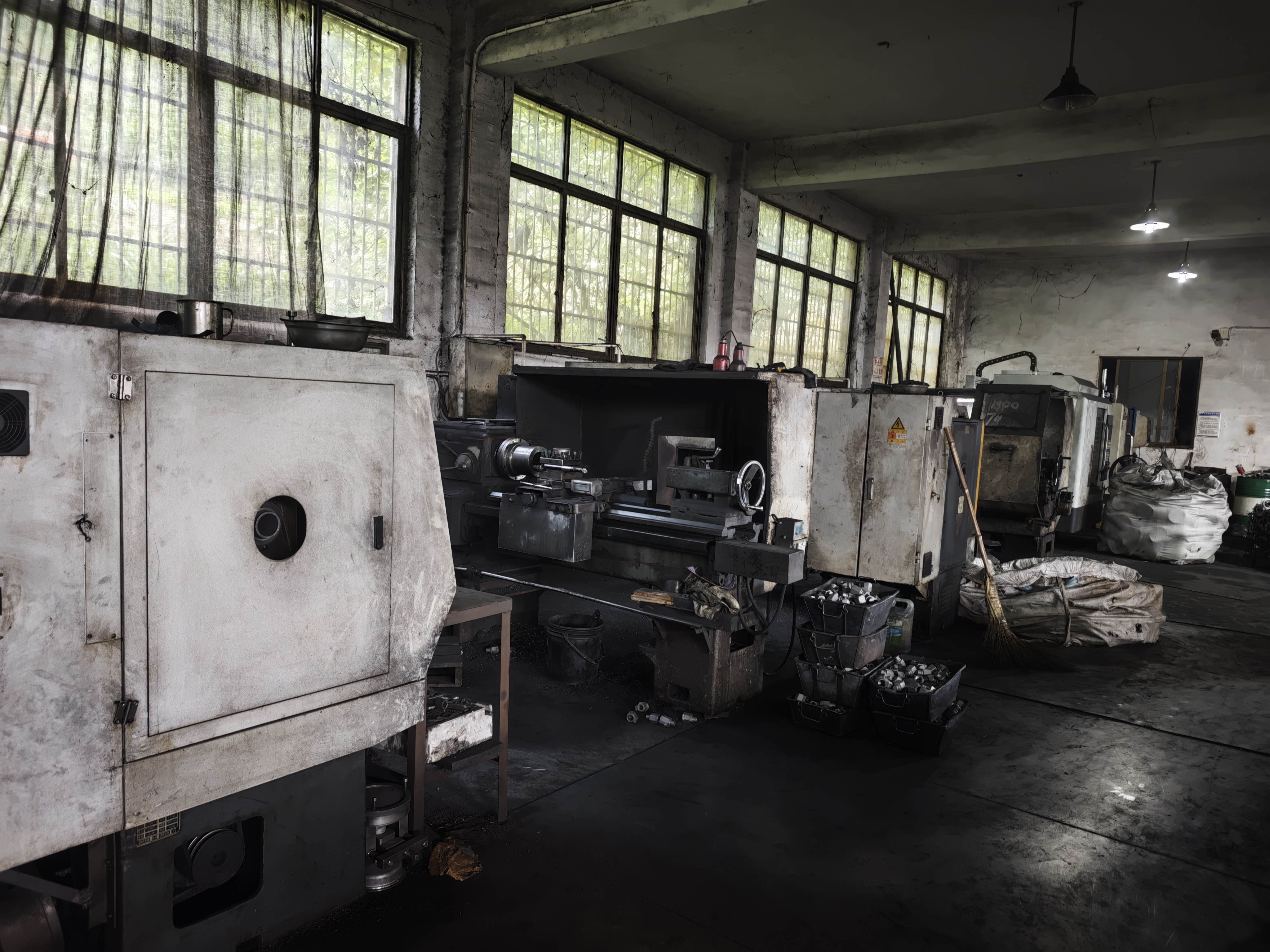 Row of turning machines by the workshop windows